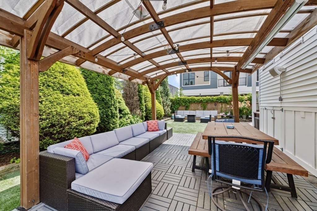 58-60 Cabot Street Everett, MA 02149 - Photo 27 of 39 a outdoor living space with furniture and a fireplace