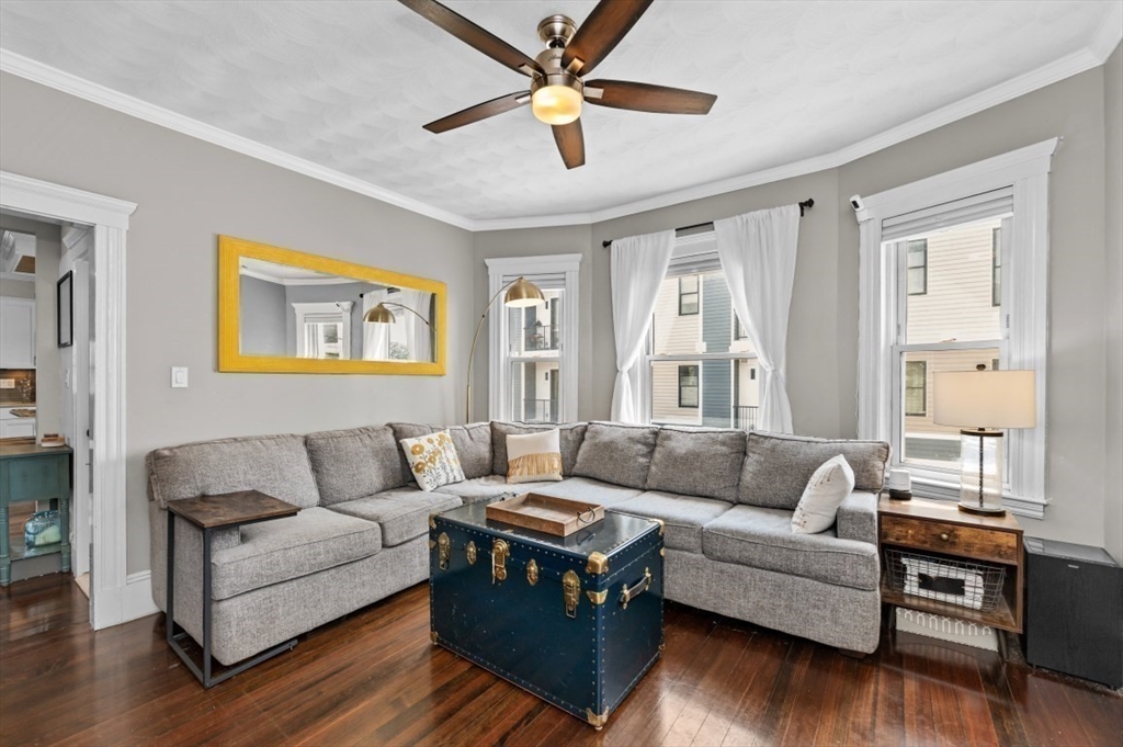58-60 Cabot Street Everett, MA 02149 - Photo 3 of 39 a living room with furniture and a large window
