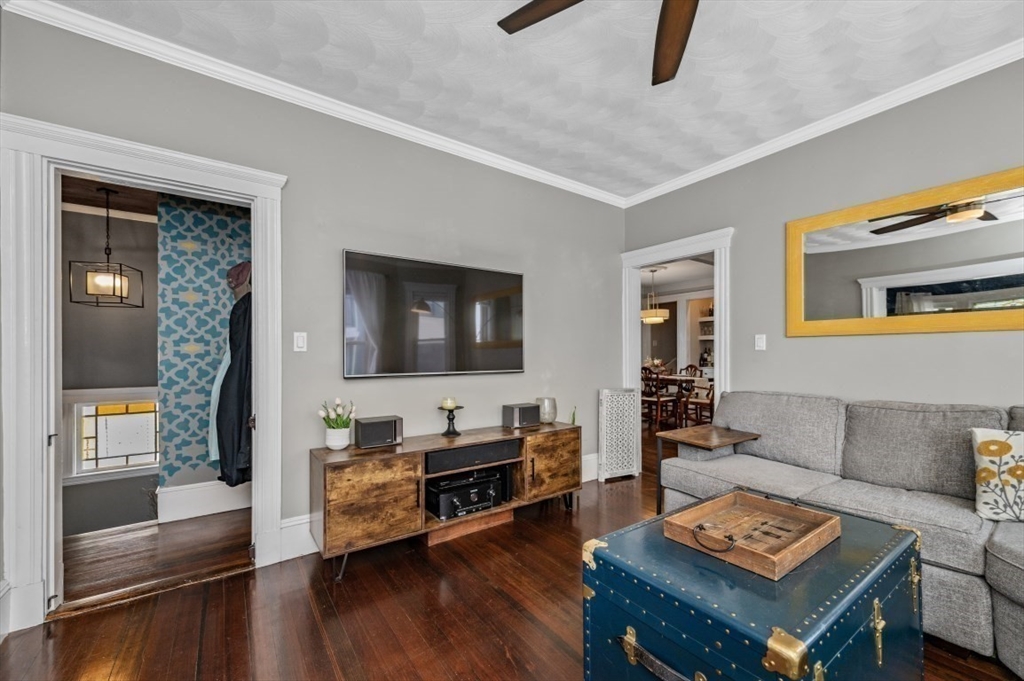 58-60 Cabot Street Everett, MA 02149 - Photo 4 of 39 a living room with furniture and a flat screen tv