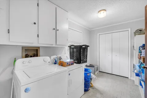 a view of storage and utility room with washer and dryer
