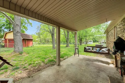 a view of a house with backyard from a porch