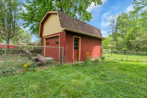 a view of a backyard of the house