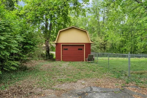 a view of a backyard with a car parked in it