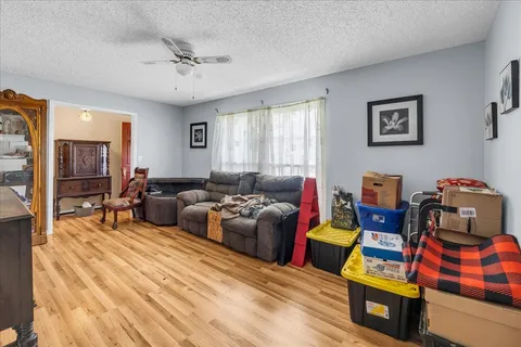 a living room with furniture and a window