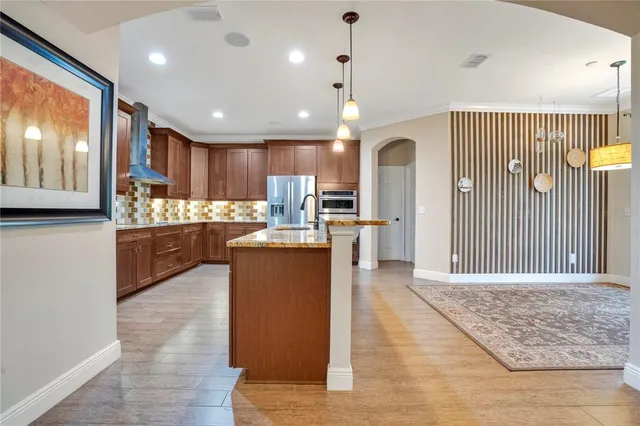 a view of kitchen with cabinets and stainless steel appliances