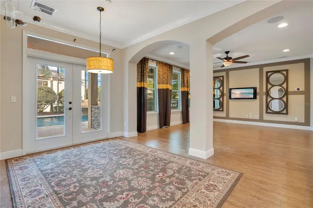 a view of a livingroom with wooden floor and window