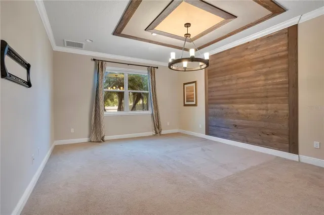 a spacious bedroom with a bed and a window