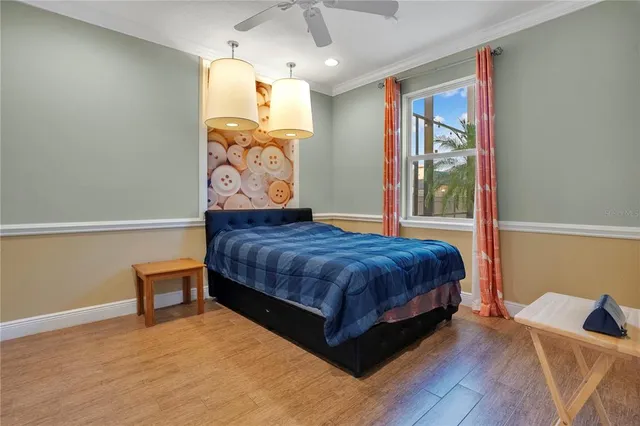 an empty room with windows and ceiling fan