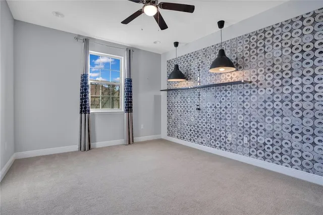 a utility room with granite countertop cabinets washer and dryer