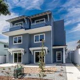 a front view of a house with parking space