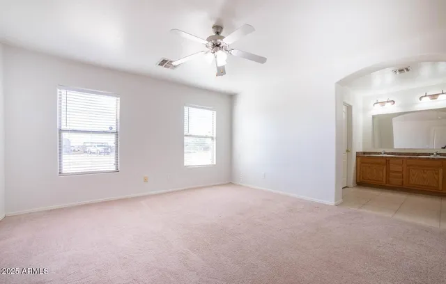 a bathroom with a granite countertop sink mirror and a
