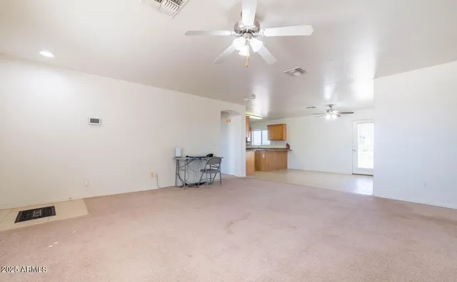 a kitchen with a sink stove top oven and cabinets
