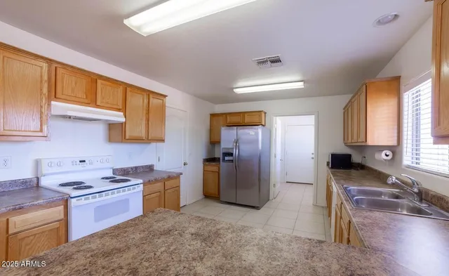 a view of kitchen with windows