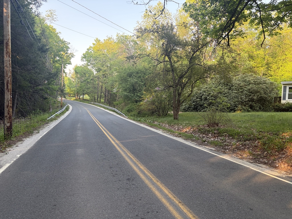 11 South Chesterfield Road Goshen, MA 01096 - Photo 5 of 30 a view of a road with a yard