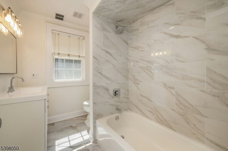 16 Walnut Street Summit, NJ 07901 - Photo 18 of 24 a bathroom with a bathtub and shower