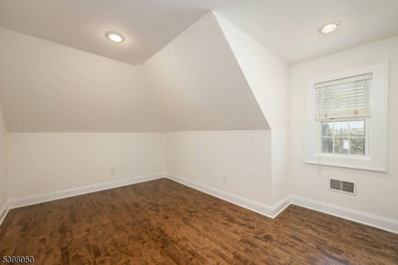 16 Walnut Street Summit, NJ 07901 - Photo 20 of 24 an empty room with a window