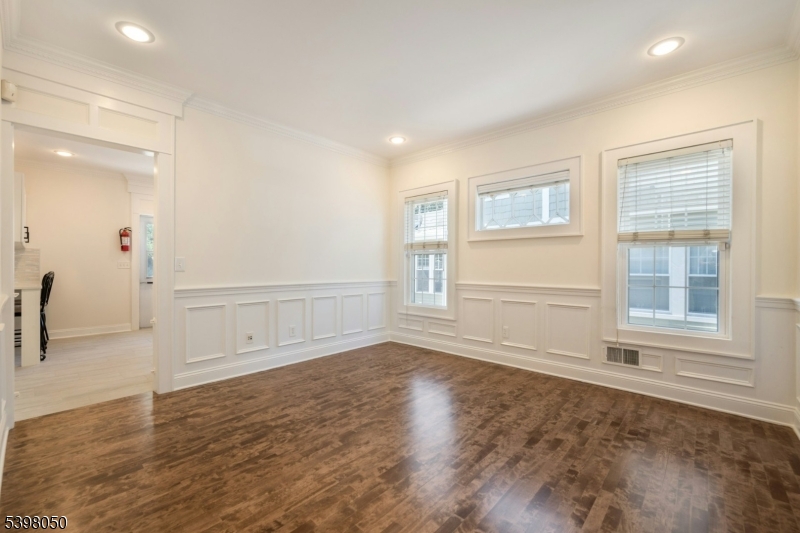 16 Walnut Street Summit, NJ 07901 - Photo 7 of 24 an empty room with wooden floor and windows