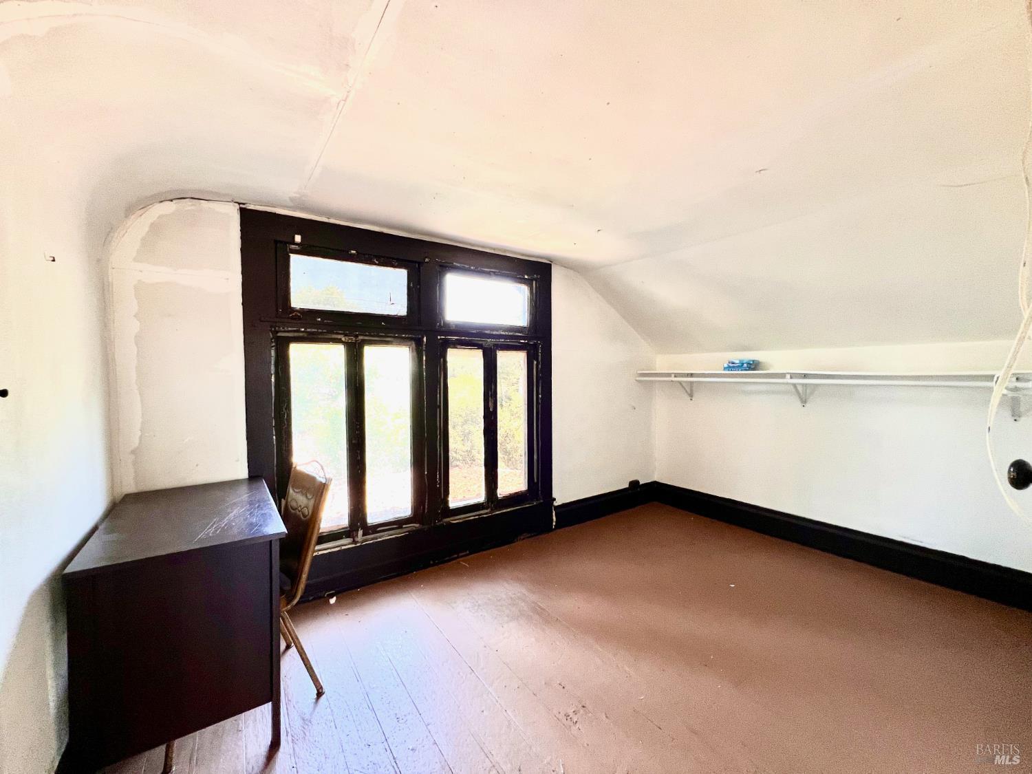 308 Coast Street Willits, CA 95490 - Photo 15 of 23 an empty room with wooden floor and windows