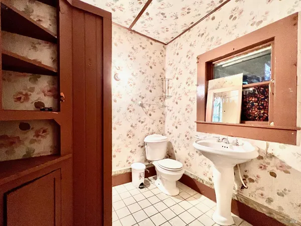 a bathroom with a sink vanity and a mirror