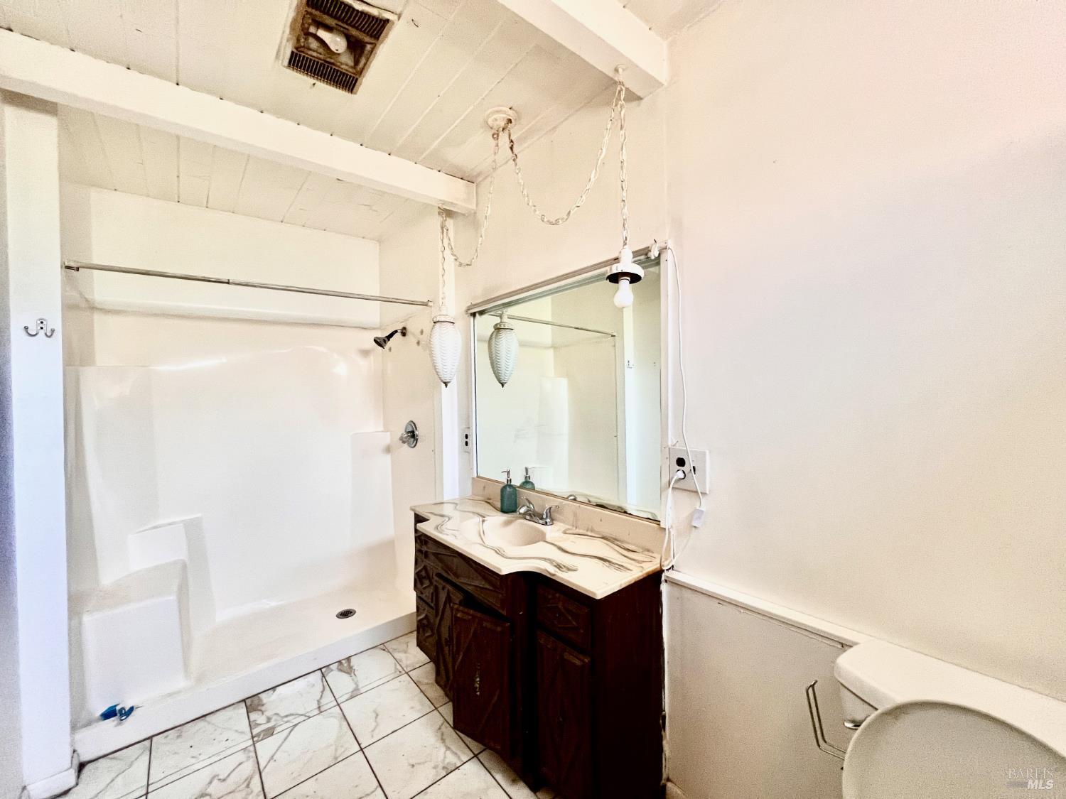 308 Coast Street Willits, CA 95490 - Photo 19 of 23 a bathroom with a sink vanity and a mirror