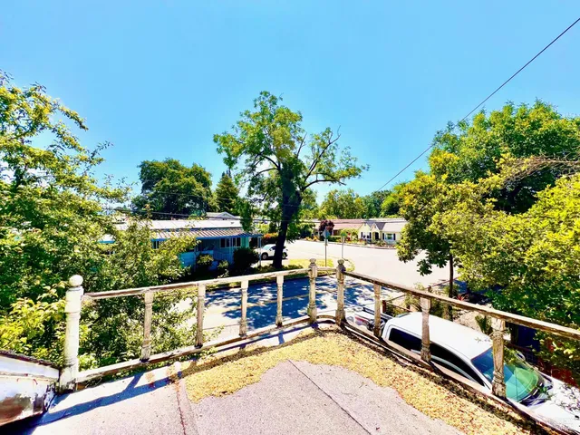 a view of a balcony with chairs