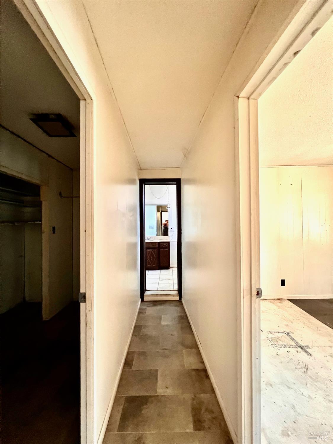 308 Coast Street Willits, CA 95490 - Photo 6 of 23 a view of a hallway with wooden floor and staircase