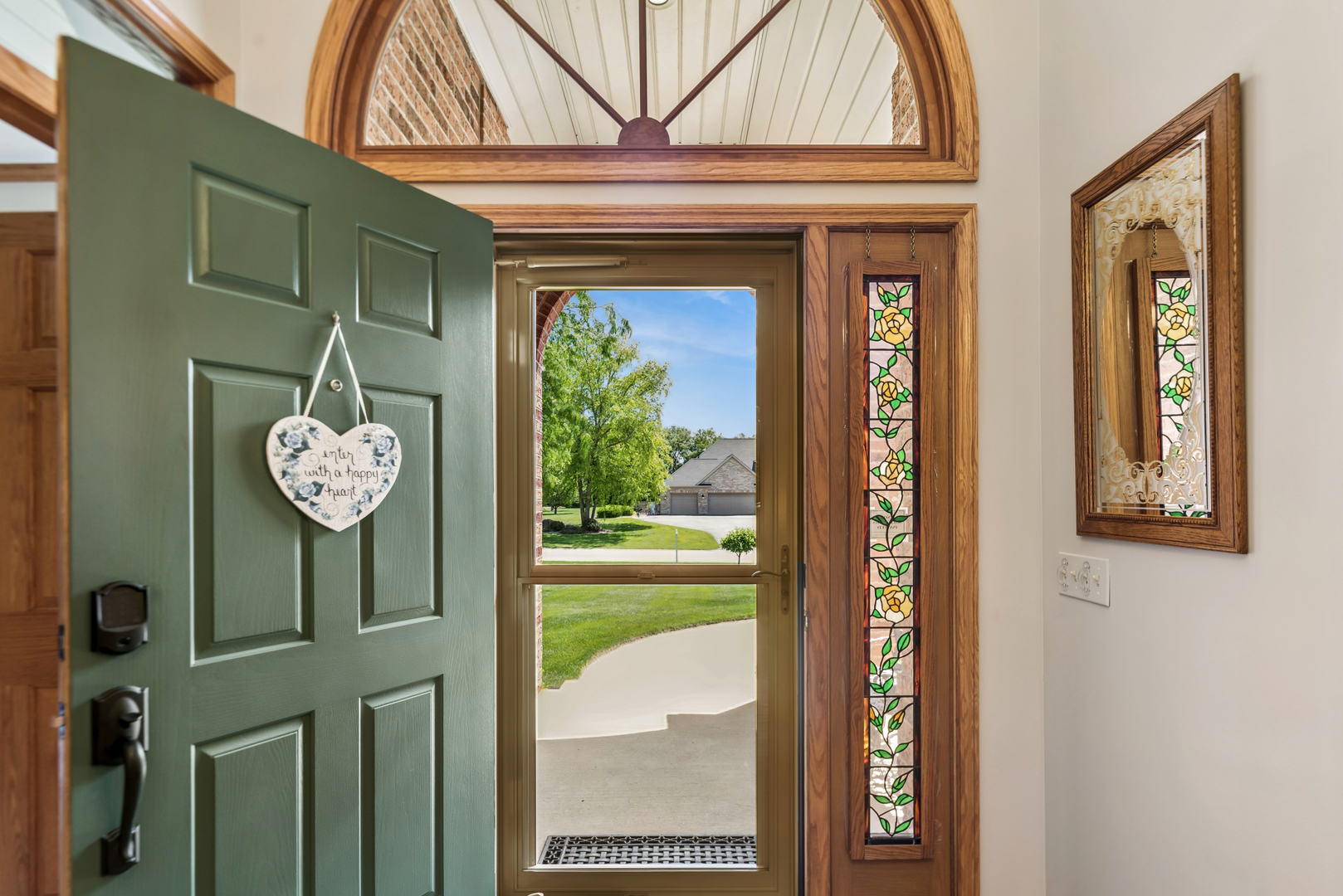10907 Red Hawk Lane Spring Grove, IL 60071 - Photo 8 of 44 a front view of a house with a hallway and a chandelier