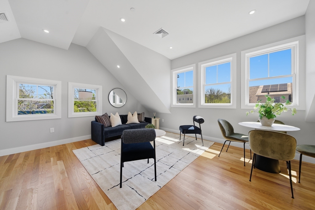 174 Walnut Street, Unit 3 Somerville, MA 02145 - Photo 3 of 38 a living room with furniture and a window
