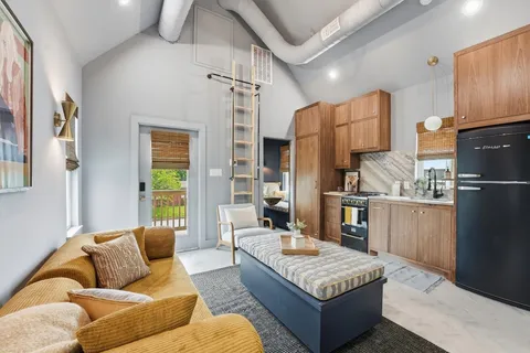 a living room with granite countertop furniture and a couch
