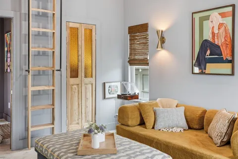 a living room with furniture and a couch