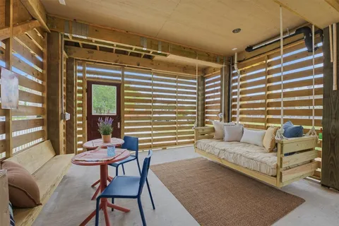 a living room with furniture and a window