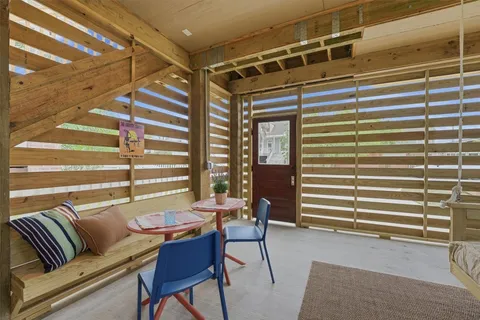 a view of a livingroom with furniture and windows