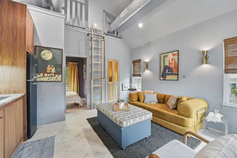 a living room with furniture and a couch