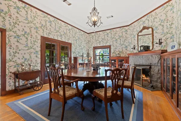 a view of living room and wooden floor