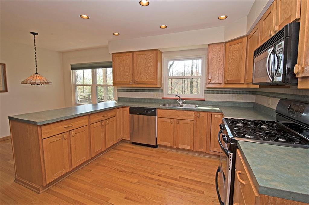 106 Tree Farm Road Pittsburgh, PA 15238 - Photo 5 of 23 Eat-in kitchen features a gas range.