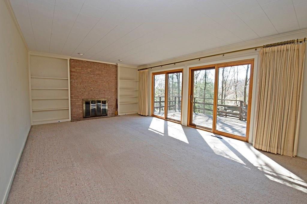 106 Tree Farm Road Pittsburgh, PA 15238 - Photo 8 of 23 The family room features built-in shelving, a gas start/log burning fireplace, a wet bar and large glass door that open onto the private deck.
