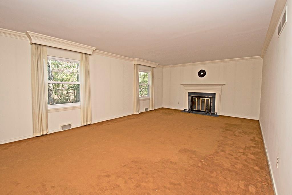 106 Tree Farm Road Pittsburgh, PA 15238 - Photo 9 of 23 Formal living room with crown molding and gas start/log burning fireplace.