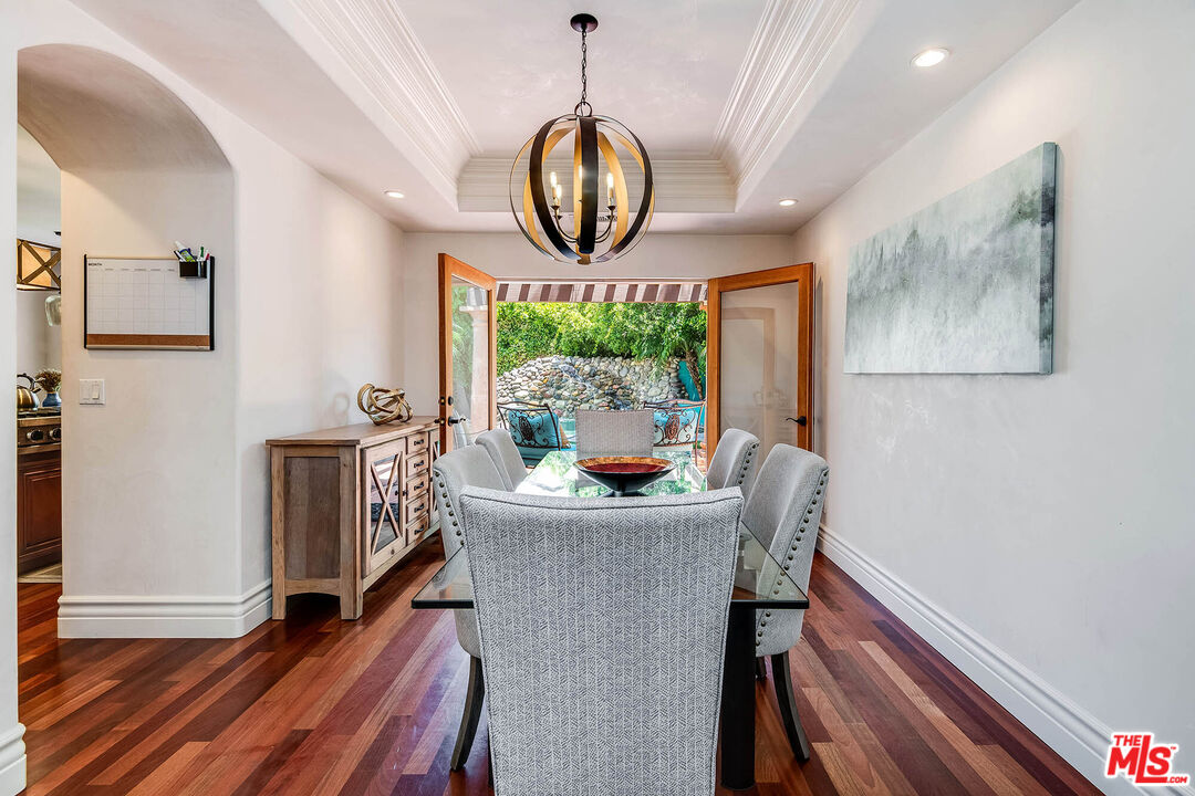 4520 Tyrone Avenue Sherman Oaks, CA 91423 - Photo 14 of 61 a dining room with furniture window and wooden floor