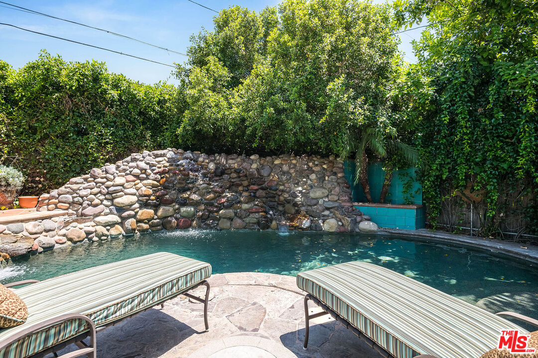 4520 Tyrone Avenue Sherman Oaks, CA 91423 - Photo 19 of 61 a view of a wooden deck with chairs and a yard