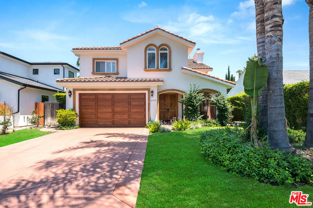 4520 Tyrone Avenue Sherman Oaks, CA 91423 - Photo 2 of 61 a front view of a house with a garden and yard