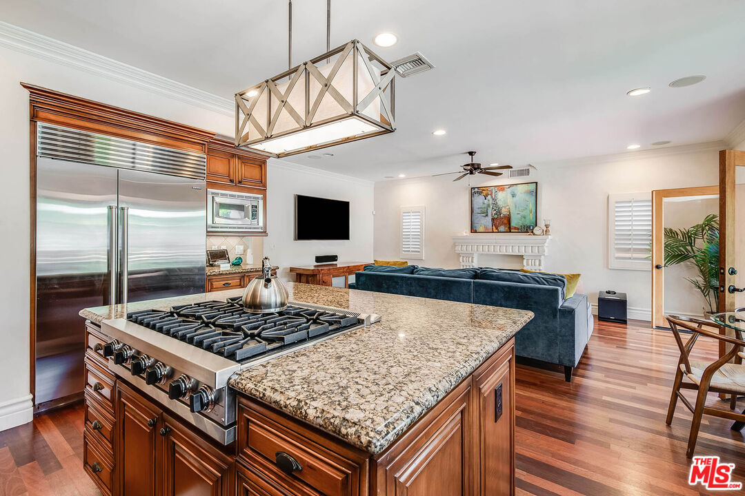 4520 Tyrone Avenue Sherman Oaks, CA 91423 - Photo 32 of 61 a kitchen with stove and wooden floor