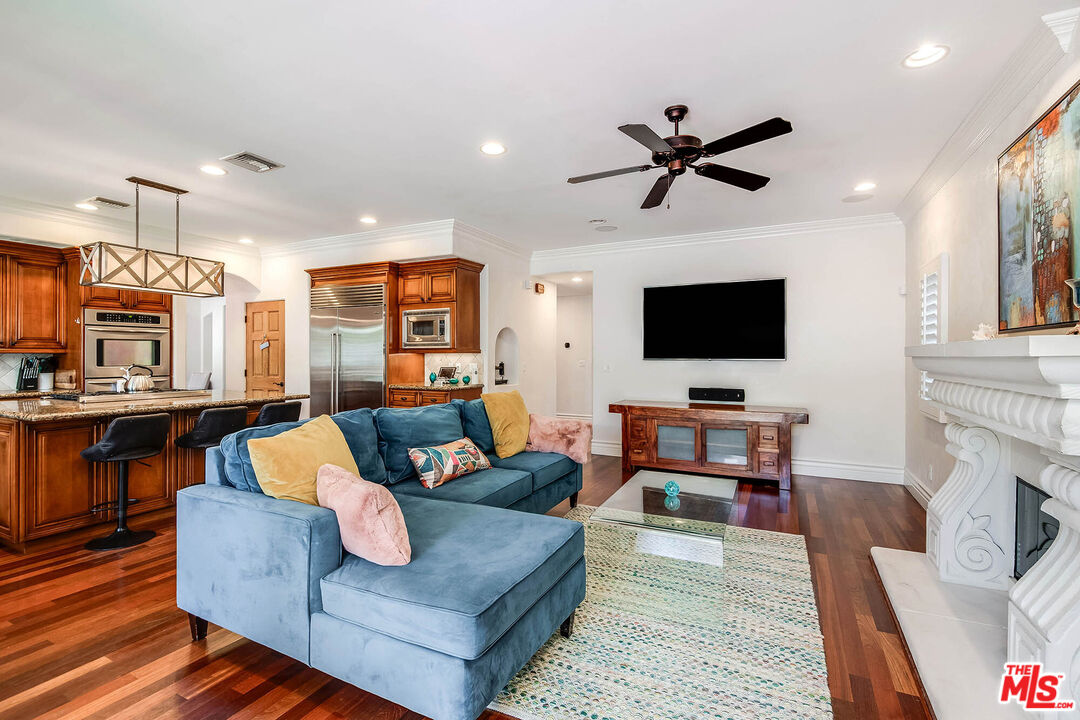 4520 Tyrone Avenue Sherman Oaks, CA 91423 - Photo 36 of 61 a living room with fireplace furniture and a flat screen tv