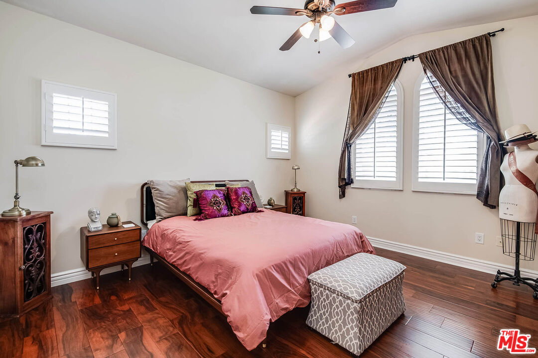 4520 Tyrone Avenue Sherman Oaks, CA 91423 - Photo 46 of 61 a bedroom with a bed and wooden floor