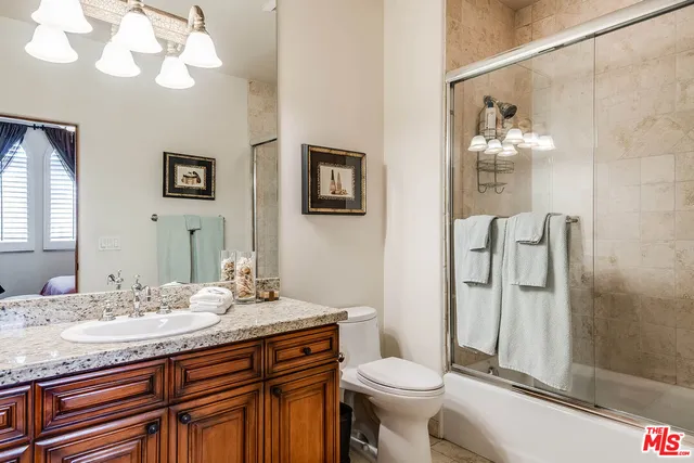 a bathroom with a tub and shower