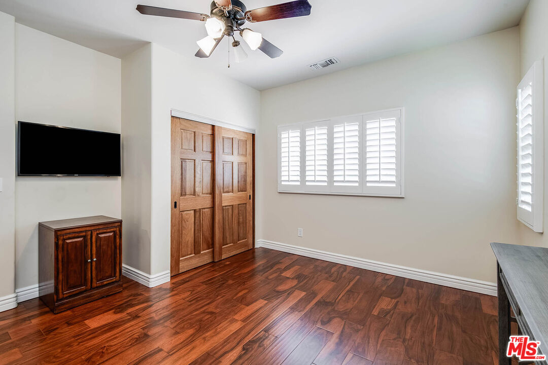 4520 Tyrone Avenue Sherman Oaks, CA 91423 - Photo 50 of 61 a view of livingroom with hardwood floor and window