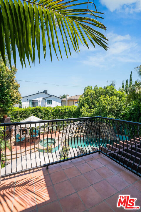 4520 Tyrone Avenue Sherman Oaks, CA 91423 - Photo 57 of 61 a balcony with potted plants and wooden fence