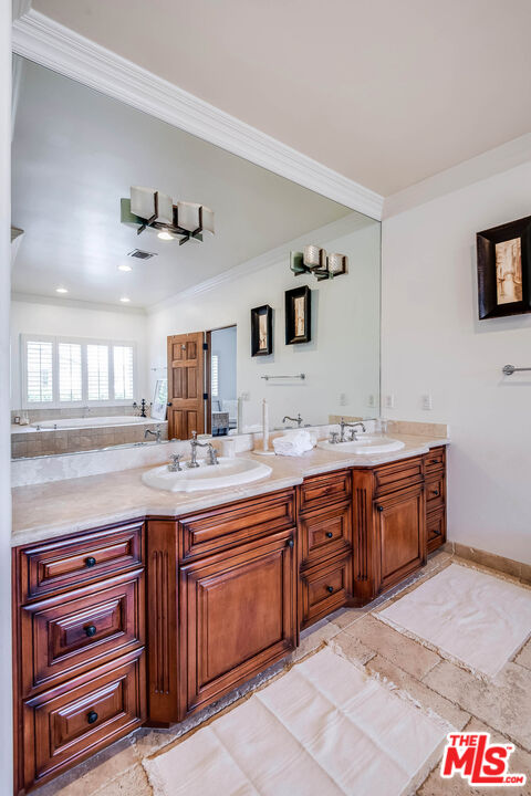 4520 Tyrone Avenue Sherman Oaks, CA 91423 - Photo 60 of 61 a spacious bathroom with a granite countertop sink and a mirror