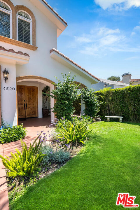 4520 Tyrone Avenue Sherman Oaks, CA 91423 - Photo 6 of 61 a front view of a house with a yard