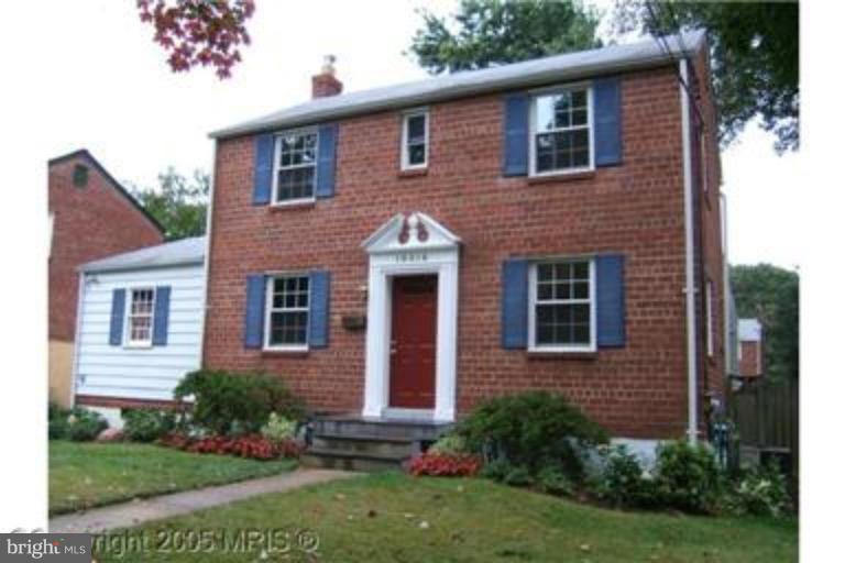 10016 Raynor Road Silver Spring, MD 20901 - Photo 1 of 1 a front view of a house with garden