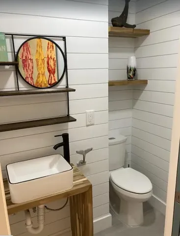 a bathroom with a toilet and a sink